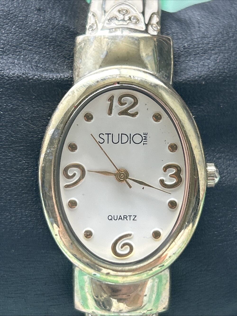 Studio Time Gold Tone White Band Women’s Cuff Watch